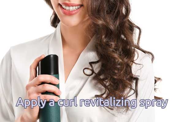 Apply a curl revitalizing spray